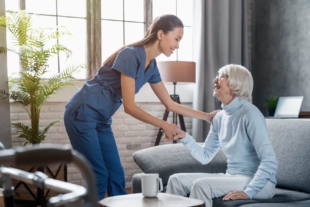 A US Wound nurse practitioner caring for a patient in their living room